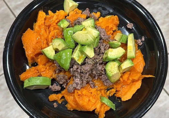 Bowl of sweet potatoes, beef, and avocado.